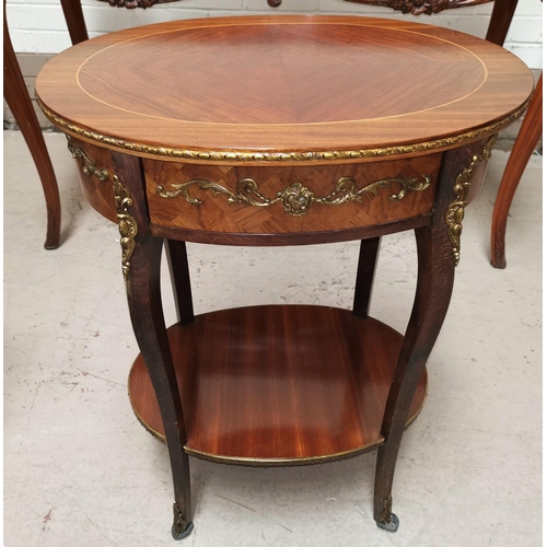 538 - A Louis XV style quarter veneered oval 2 tier occasional table on tapering cabriole legs