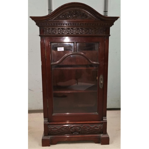 543 - A small Edwardian carved mahogany wall cupboard with arch pediment and glazed door
