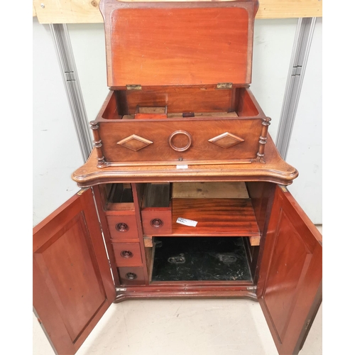 599 - A Victorian mahogany sewing/side cabinet enclosed by 2 diamond pattern doors, with hinged box top