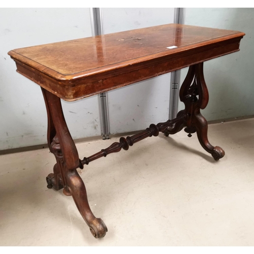 610 - A mid Victorian fold over card table in burr walnut on trestle base with turned stretcher, 38
