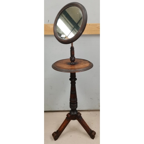 637 - An Edwardian shaving stand with adjustable mirror and circular top, on turned column and 3 splay fee... 