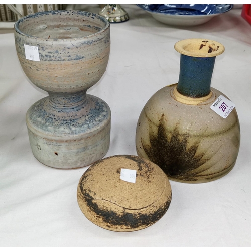 207 - Three  studio pottery pieces:  a goblet shaped vase in mottled blue and brown, the base stamped 'PR'... 