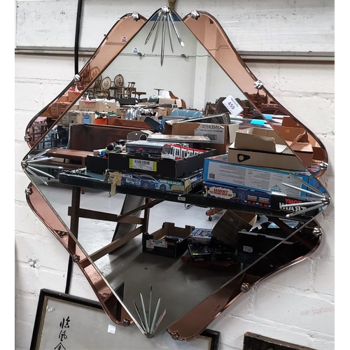 459 - An Art Deco wall mirror in square peach glass frame