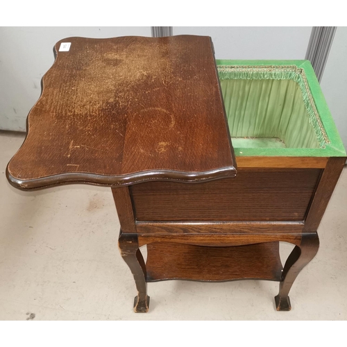 544 - A 1930's swivel top oak work / card table with undershelf