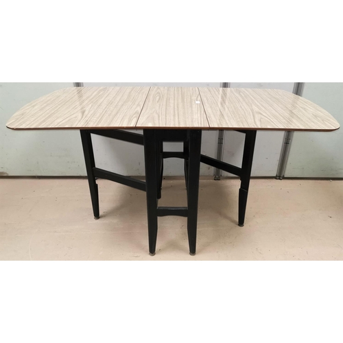 619 - A G-Plan drop leaf table with grey wood finish Formica top, ebonised gate leg base, extending to 50