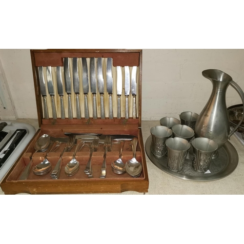 320 - A mid 20th century canteen of cutlery in oak fitted box; a pewter wine set with jug, tumblers and tr... 