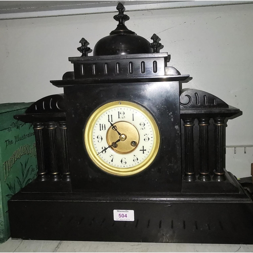 504 - A black slate classical architectural style mantel clock with 3 pillars to each side, striking on go... 