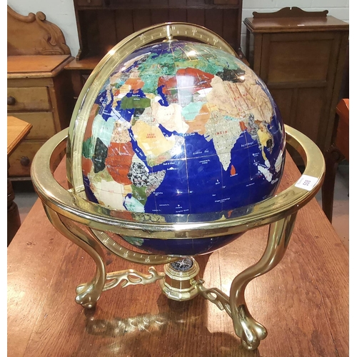 508 - A large scale world globe set with semi-precious stone veneers, gilt mount, diameter 13
