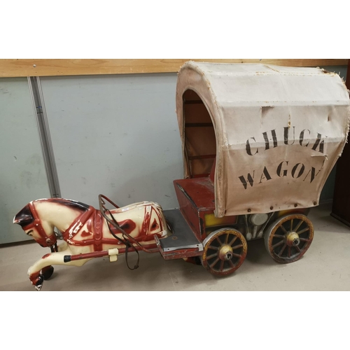 509A - An early / mid 20th century 'Chuck Wagon' and horse childrens fairground ride-on unit in painted met... 