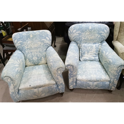 527 - A pair of Edwardian arm chairs upholstered in traditional blue fabric