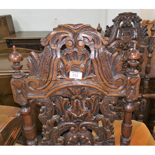 533 - A set of 4 19th century Carolean style oak dining chairs, with extensively caved high backs