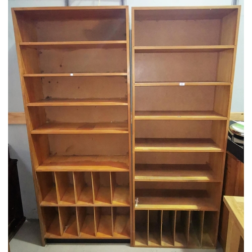 553 - A pair of lightwood full height bookcases/record stands