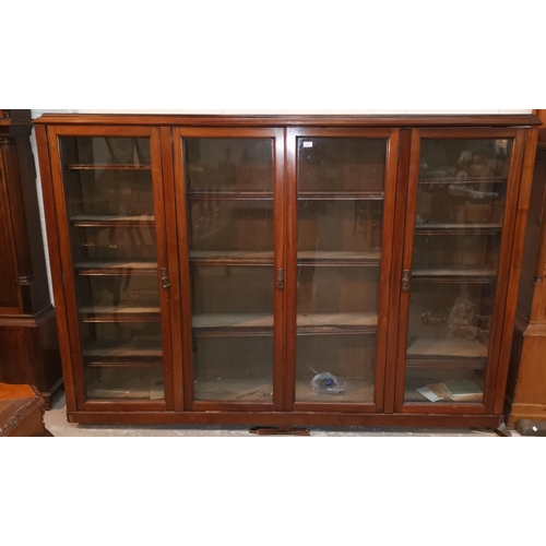 554 - An early 20th century mahogany library bookcase enclosed by 4 glazed doors,
84