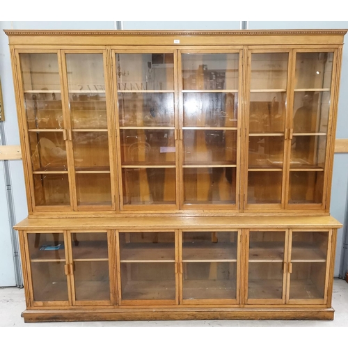 556 - An early 20th century oak large library bookcase enclosed by 5 upper and 5 lower glazed doors