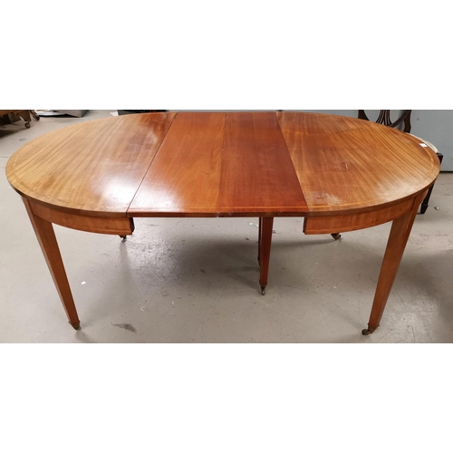 606 - A 19th century circular extending dining table in crossbanded mahogany, on square tapering legs with... 