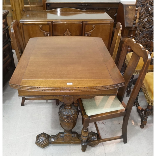 642 - A 1930's oak dining suite with draw leaf table on carved bulbous legs, 4 chairs and sideboard of 2 c... 