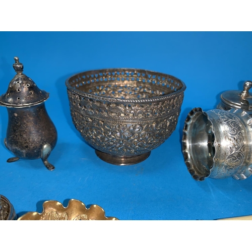 322 - An oriental bowl in pierced and embossed white metal, diameter3.5