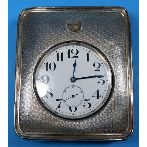 323 - A large face pocket watch, silver plate with enamel dial in associated hallmarked silver travelling ... 