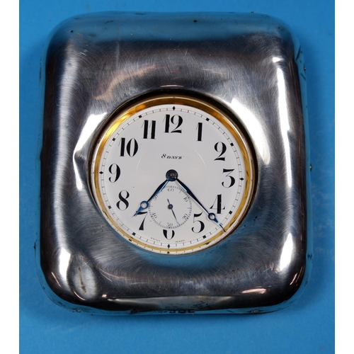 324 - A large travelling clock/pocket watch in silver mounted case