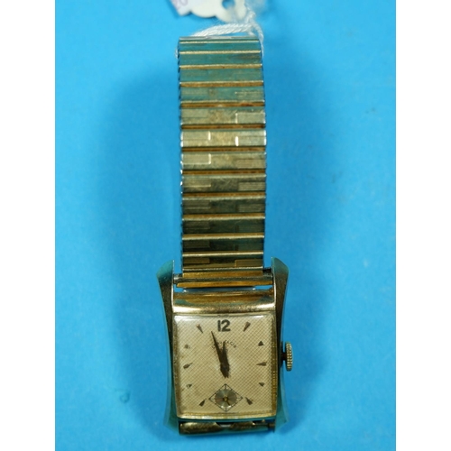 371 - A 1930's gent's wristwatch in yellow metal case, stamped '14 Karat Gold', with presentation inscript... 