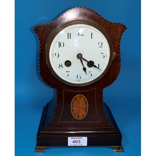 403 - An Edwardian inlaid mahogany tulip shaped mantel clock with French striking drum movement