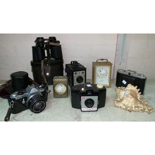 427 - A Pentax SLR camera; 3 vintage cameras; binoculars; a bedside clock; etc.