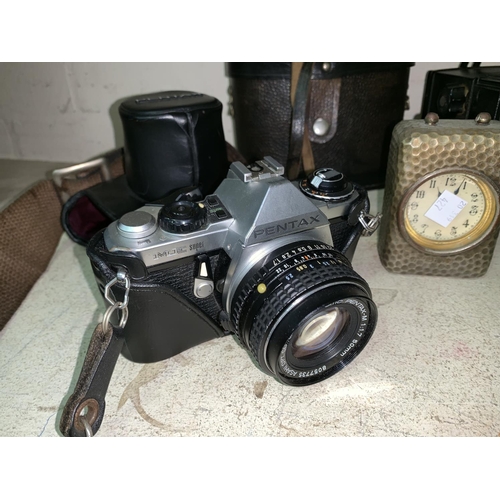 427 - A Pentax SLR camera; 3 vintage cameras; binoculars; a bedside clock; etc.