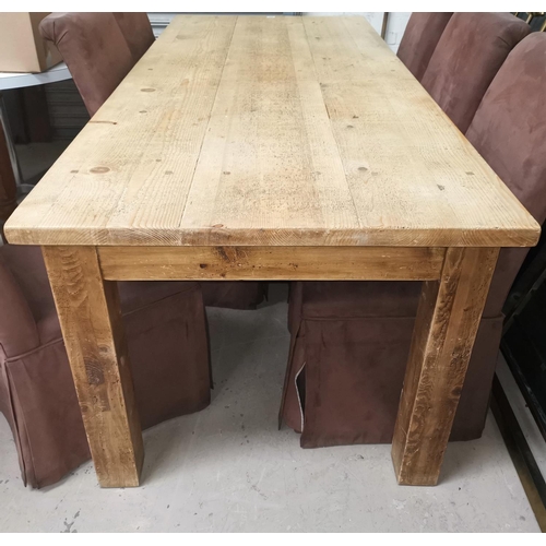 629 - A Victorian style large rectangular dining table in stripped and distressed pine, on square legs