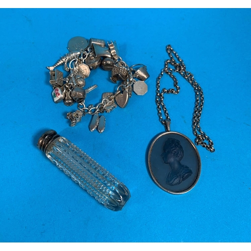 323C - A silver charm bracelet (76gm); a silver mounted 19th century glass cameo pendant on chain