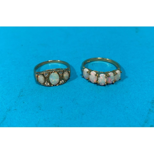 323F - A Victorian style 3 stone opal dress ring; a similar ring set with 5 stones, stamped '375', 4.5gm