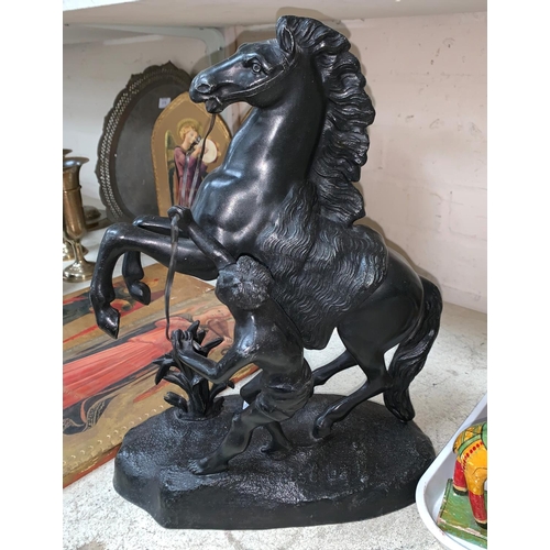 412 - A 19th century pair of bronzed spelter Marley horses, one signed, height 16