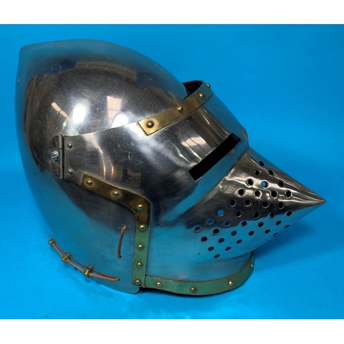 389B - A brass mounted pierced and riveted Pigface Bascinet reproduction helmet, 11”