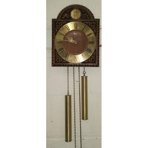 400 - A reproduction wall hanging oak clock with twin brass weights; a reproduction mahogany barometer