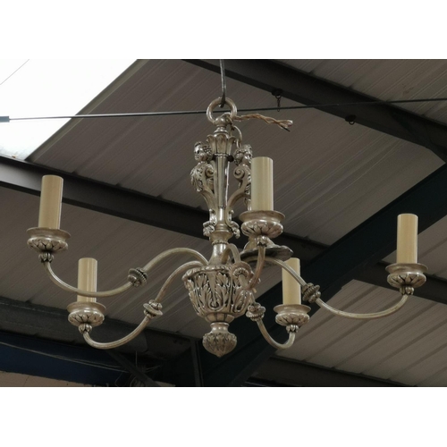 480 - A pair of five branch chandeliers with silvered metal and cherub decoration