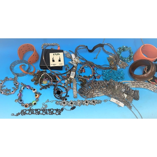 491 - A selection of costume jewellery; A chrome plated 'bullet' cigarette lighter; a scout belt; a nest o... 