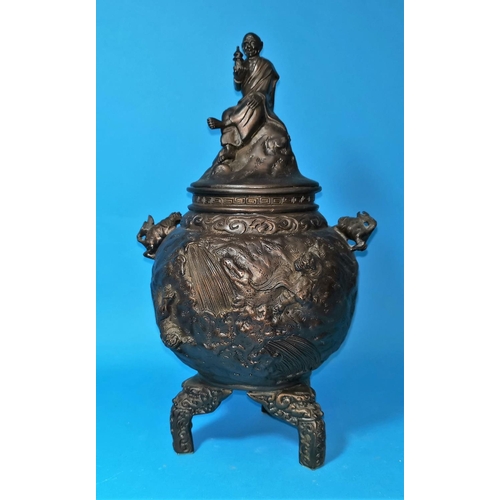 456A - A 19th century Chinese/Japanese bronze covered vase of spherical form, with seated figural finial an... 