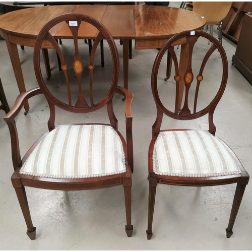 571 - An Edwardian Adam style mahogany armchair with inlaid oval back; a matching dining chair