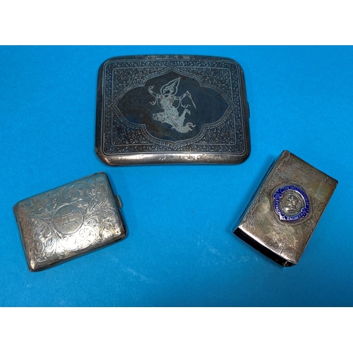 338 - A silver matchbook holder with chased decoration, Brmingham 1921; a matchbox holder with crest of In... 