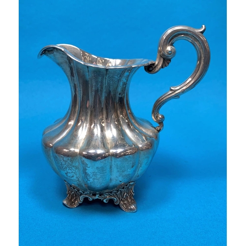 363 - A Victorian silver ribbed baluster cream jug on 4 cast acanthus feet, london 1838 8ozs