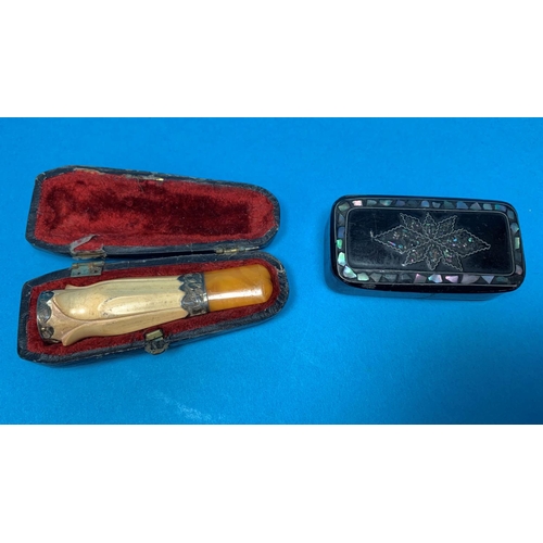 366 - A 19th century black papier mache snuff box with inlaid decoration; a meerschaum and amber cigar hol... 
