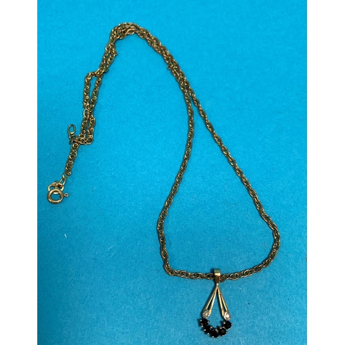 367 - An Edwardian 9 carat hallmarked gold pendant set diamond and sapphire, on multiple link chain, stamp... 