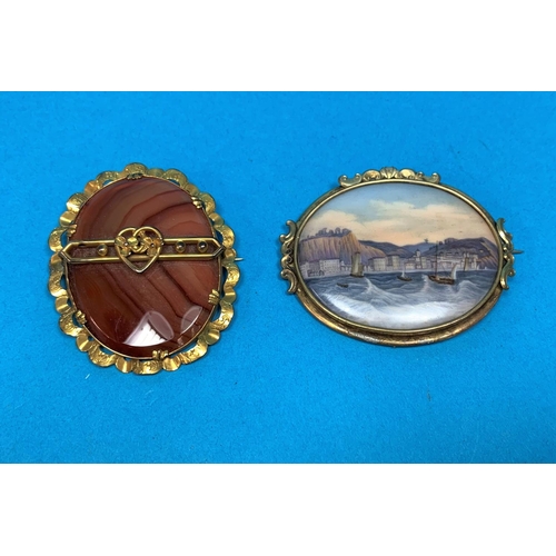 368 - A 19th century porcelain brooch, hand painted with coastal scene 