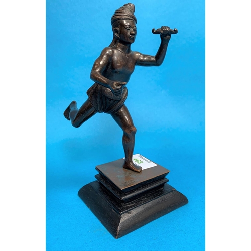 468 - A 20th century Burmese bronze depicting a man in loincloth. on wooden base, stamped 'M G Pozi n Pegu... 
