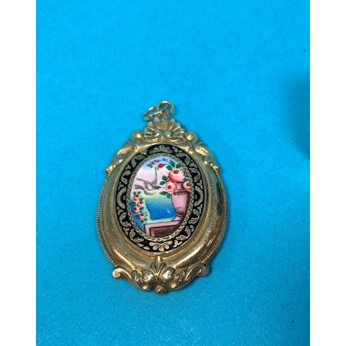 357 - A Victorian gilt metal mourning brooch/locket, decorated in black and coloured enamels with a dove a... 