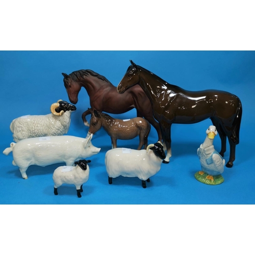 185 - A Beswick figure of a pig C H Wall; 2 Beswick horses and various sheep