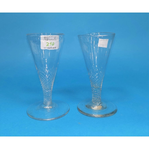 210 - A pair of Georgian conical ale glassed with wrythen stems, 13 cm