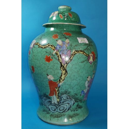 213 - A Chinese porcelain covered urn, baluster shaped with enamel decoration of figures collecting blosso... 