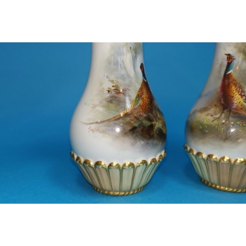 246 - An early 20th century Royal Worcester pair of porcelain vases, with hand painted with polychrome pan... 