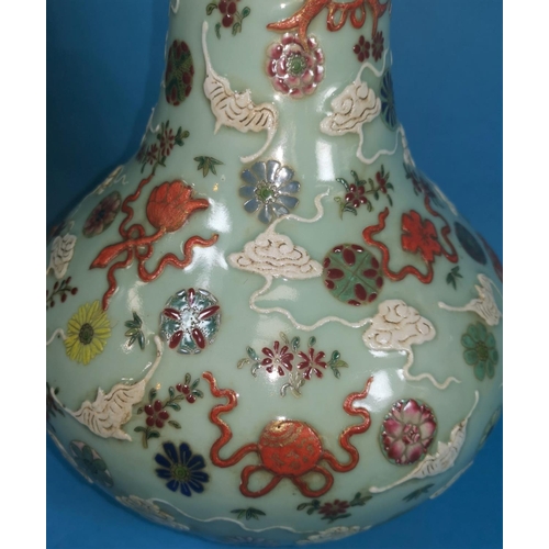 254 - A Chinese celadon baluster vase with painted decoration of clouds, fish, flowers, etc., marks to bas... 