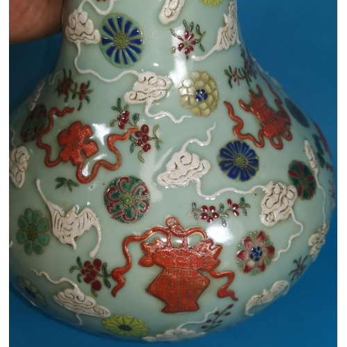 254 - A Chinese celadon baluster vase with painted decoration of clouds, fish, flowers, etc., marks to bas... 